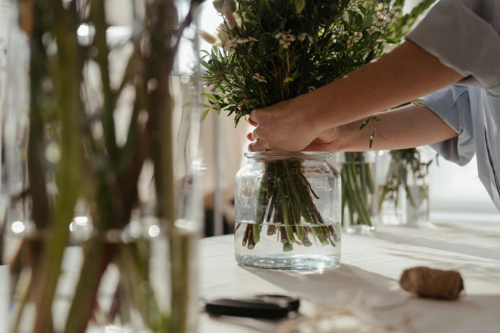 hands of florist arranging flowers